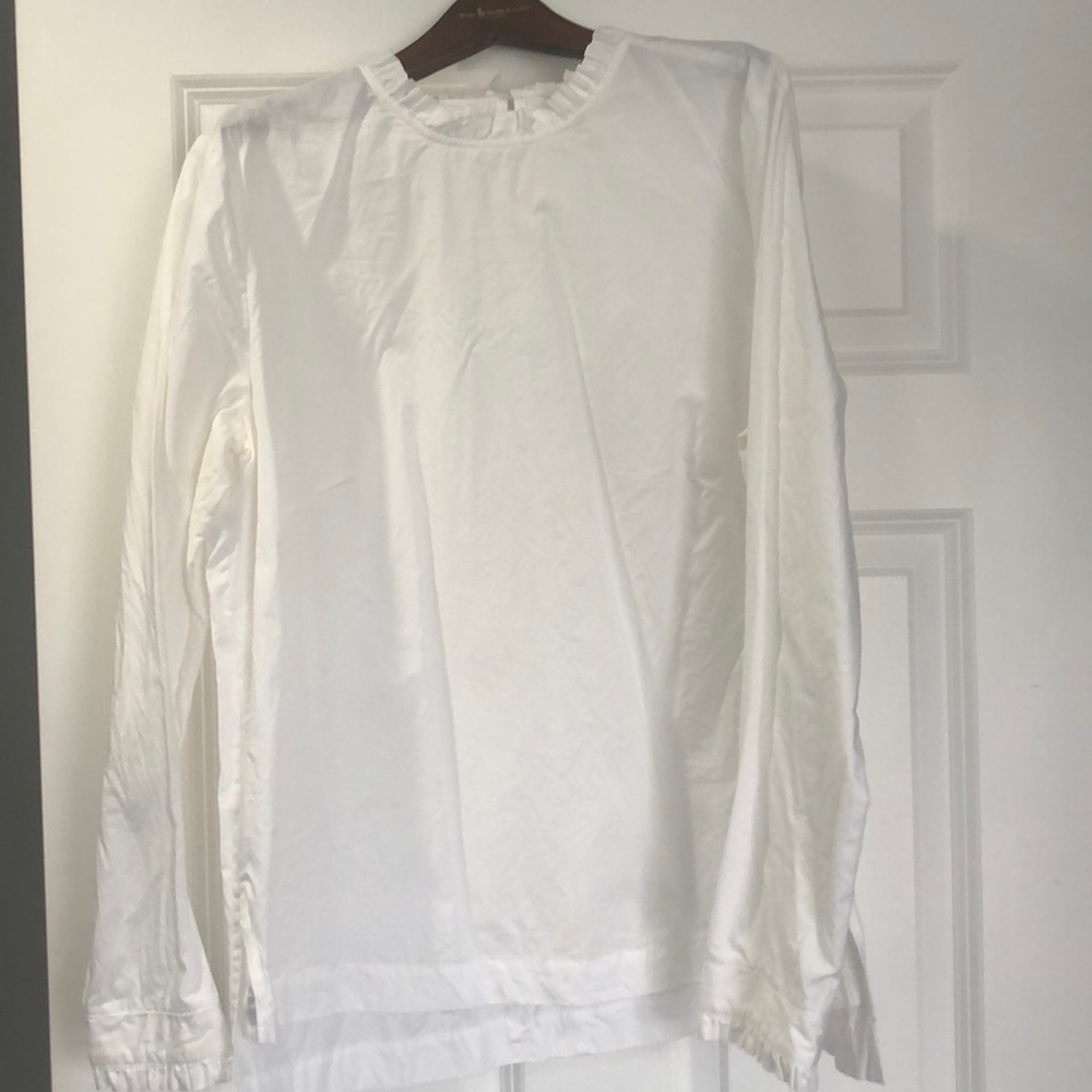 White ruffle hem top